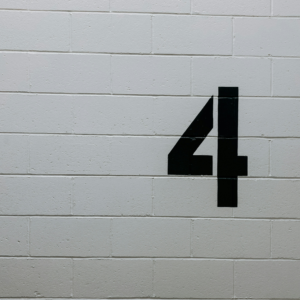 The number 4 on a brick wall