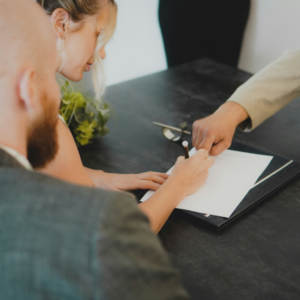 A couple signing a document